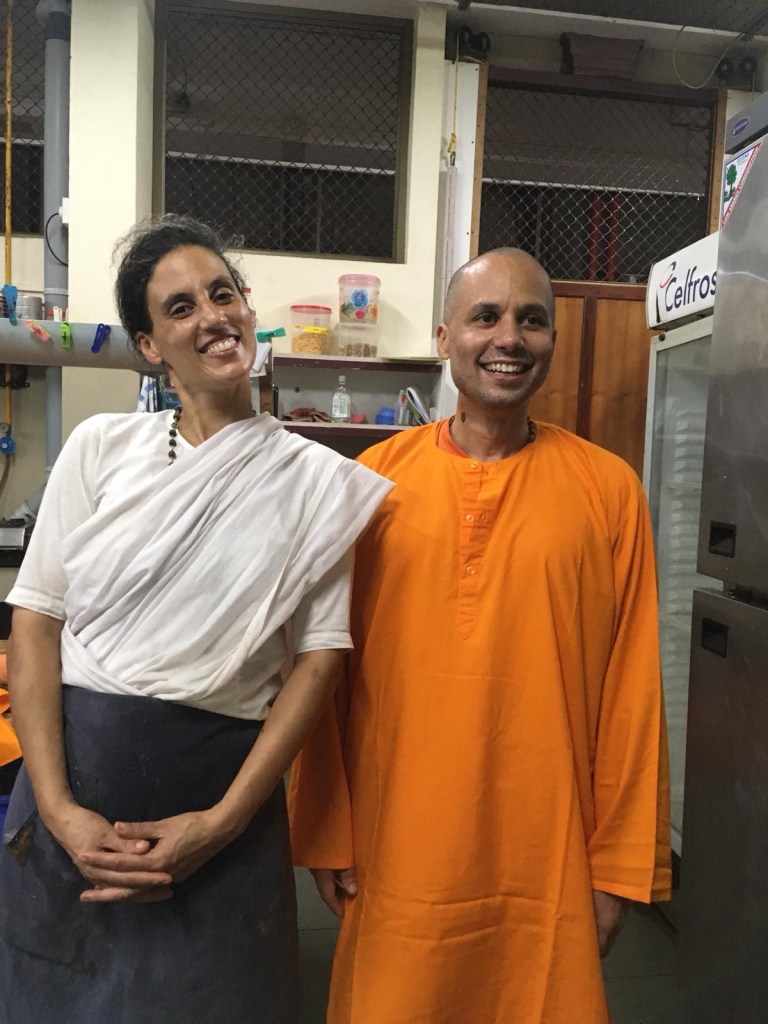 A person standing in front of a store

Description automatically generated